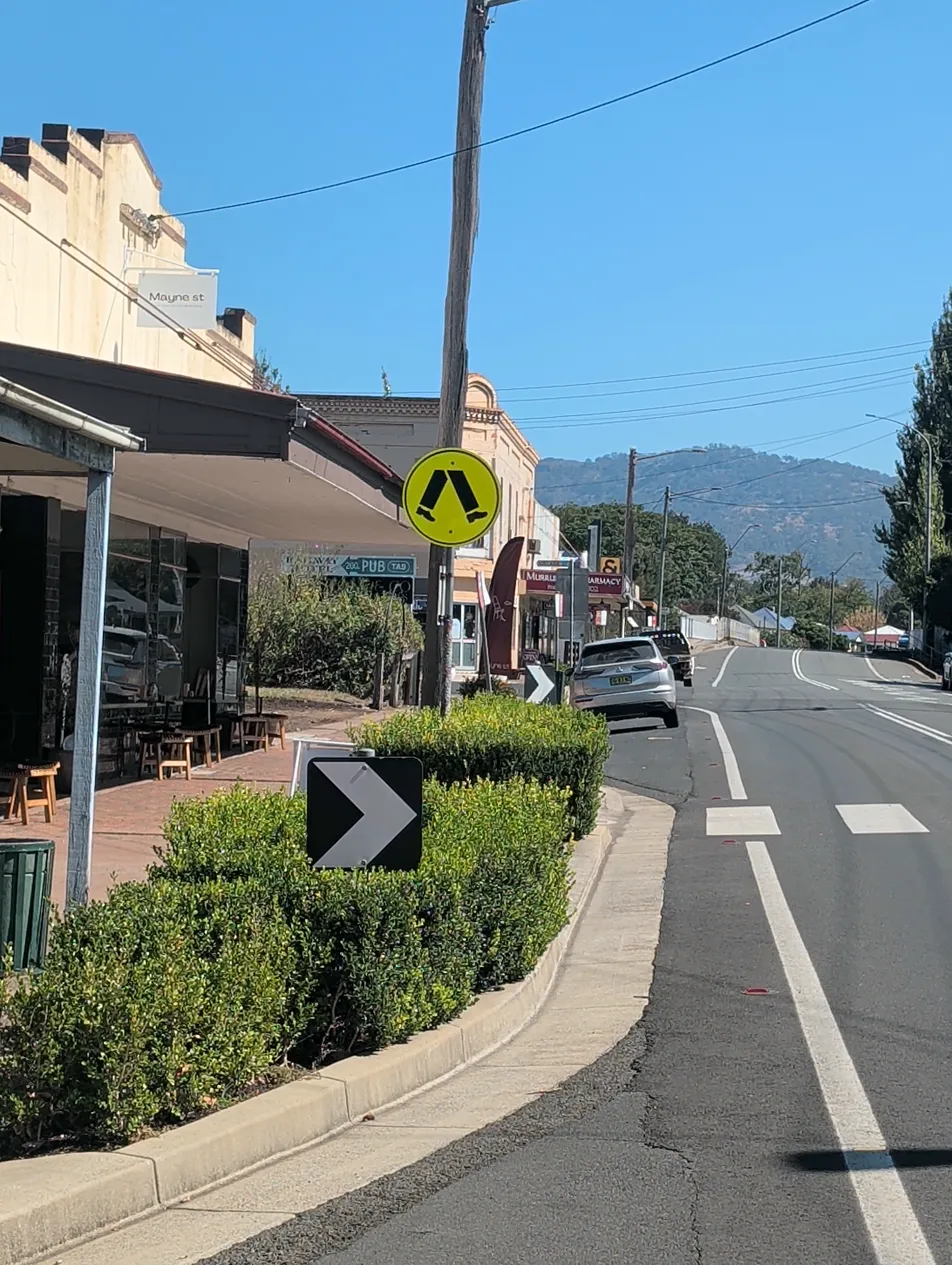 Murrurundi pedestrian crossing is hidden among shopfront awnings and street furniture